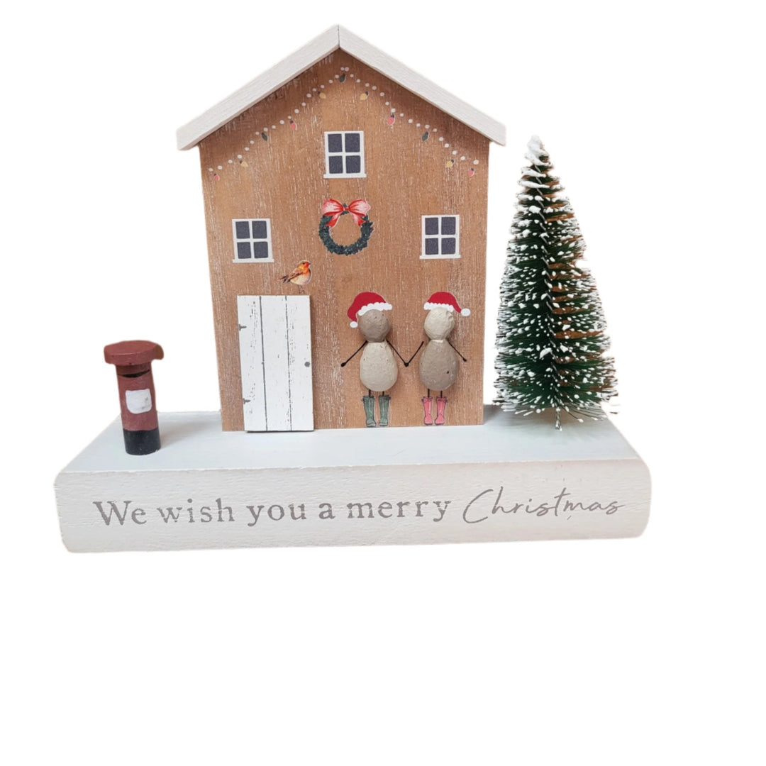 Festive Wooden House with People Pebble